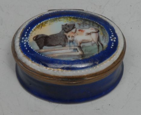A George III South Staffordshire enamel oval patch box, the painted with a pair of cows by a water trough and inscribed with 