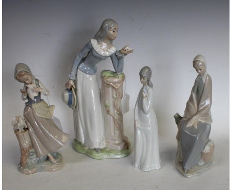 A Lladro figure, girl with doves; others including Nao, etc (4)