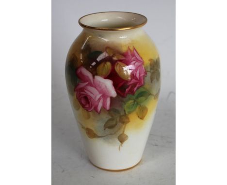 A Royal Worcester ovoid vase, painted by Millie Hunt, signed, with roses, 9.75cm high, printed crown and circle mark, shaped 