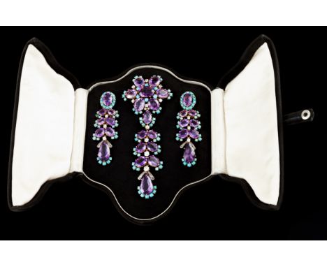 GoldBrooch of removable drop set with 14 oval cut and one pear shaped amethysts, 12 antique brilliant cut diamonds totalling 