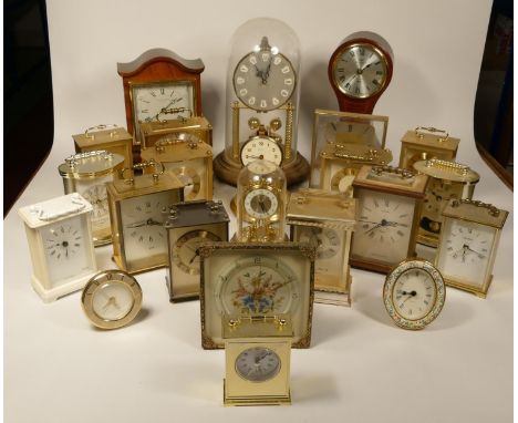 A collection of clocks to include, an Acctim quartz carriage clock, a Highlands quartz clock, a Country quartz clock, togethe