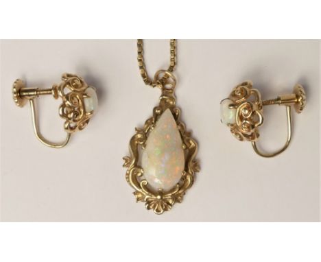 A 9ct gold opal pendant, claw set with a pear shape stone of good colour, stone 15 x 7mm, 9ct gold box link chain and a match