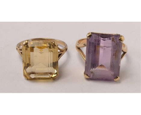 A 9ct gold and amethyst dress ring, 17 x 12mm, O 1/2 and a similar citrine ring, 15 x 13mm, O, 9.3gm 