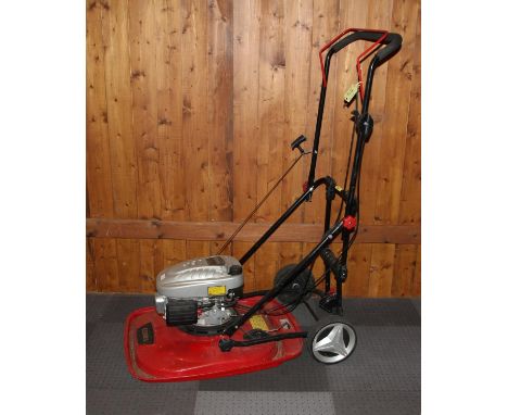 A petrol driven hover mower by Cobra, 98.5cc OHV engine, 20 inch cut. 