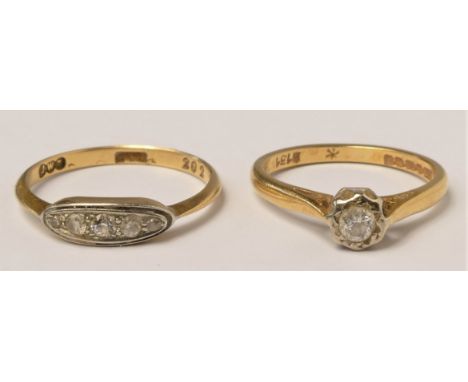 An 18ct gold diamond four stone ring, set with graduated old cut stones, ?, and an 18ct gold single stone diamond ring, set w