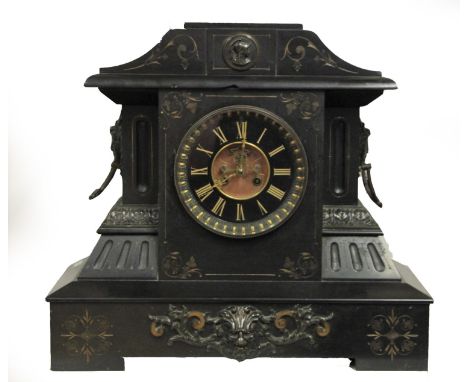 A Victorian slate mantel clock, the architectural case with gilt highlights, the dial with visible escapement, 47 x 44 cm 