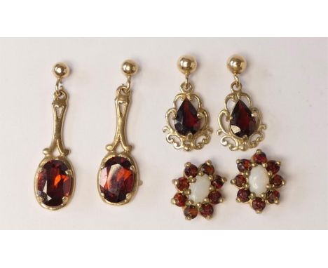 A 9ct gold opal and garnet ear studs and two pairs of garnet ear rings, 3.4gm. 