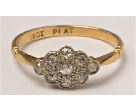 An 18ct gold diamond cluster ring, c. 1920, set with single cut stones, ? 2.2gm 