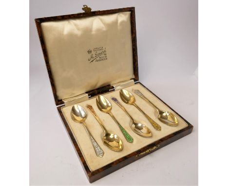 An Art Deco silver gilt and enamel set of six coffee spoons, Birmingham 19381.5oz. 
