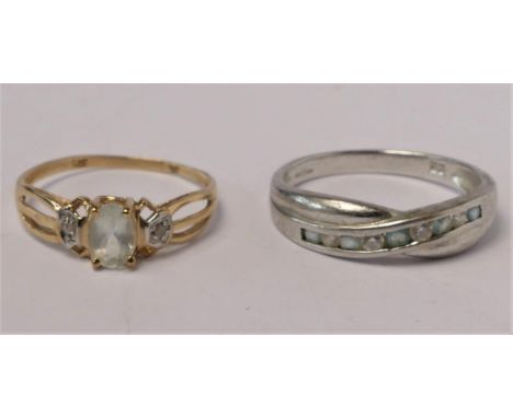 A 9ct gold aquamarine and diamond three stone ring, O and a 9ct white gold ring, Q, 3.1gm 