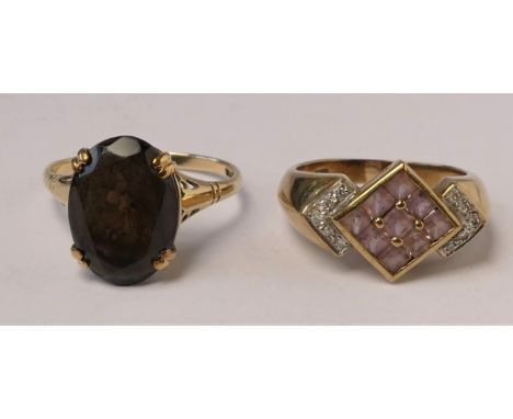 A 9ct gold and smokey quartz dress ring, p and a pink topaz ring, M, 6.2gm- 