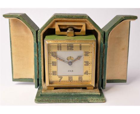 An Art Deco JAZ green craquelure and gilt metal square travelling alarm clock, 6cm, case, 
