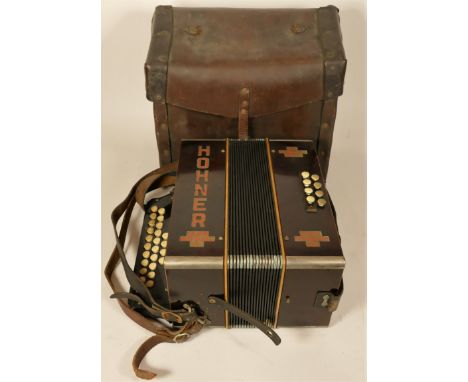 A 1930's Hohner accordion club model 11 with original leather carrying case. 