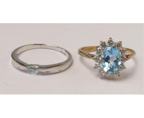 A 9ct gold blue and white stone cluster ring, P and a gold and topaz ring, P, 4 gm 