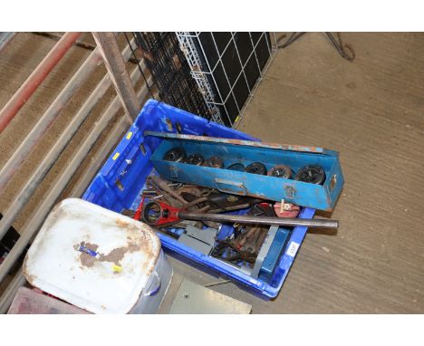A plastic box containing various hand tools and a metal case containing a pipe threader system etc.