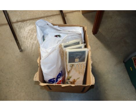A box of various fabrics and tie backs