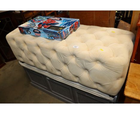 A button down upholstered stool