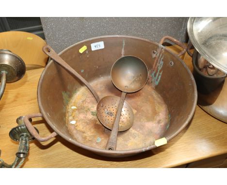 A copper preserve pan with ladle and strainer