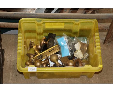 A plastic box and contents of various door furniture etc.