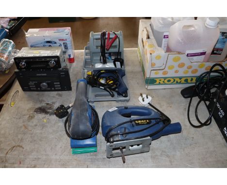 A car battery charger a Powercraft hot glue gun, a Hilka electric sander and a Powercraft PS-600n electric jigsaw