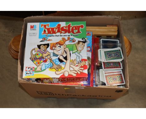 A box of various games and playing cards