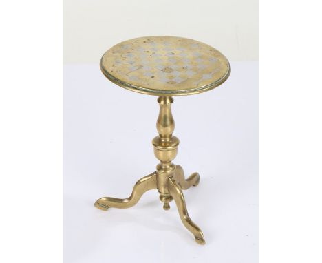 Brass miniature games table, the circular top with white metal chess board, raised on a waisted stem and tripod legs, 10.5cm 