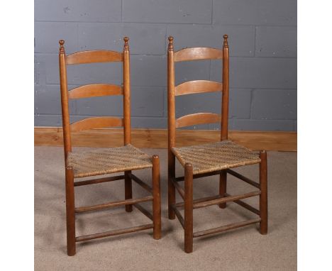 Pair of 19th Century Shaker chairs, with an arched ladder back above the rush woven seat and turned legs, (2)