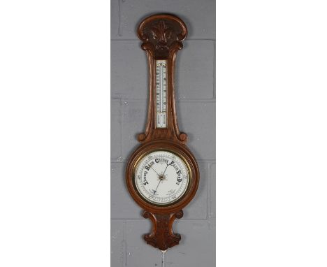 Early 20th Century oak aneroid barometer, with porcelain register and dial, 88cm tall
