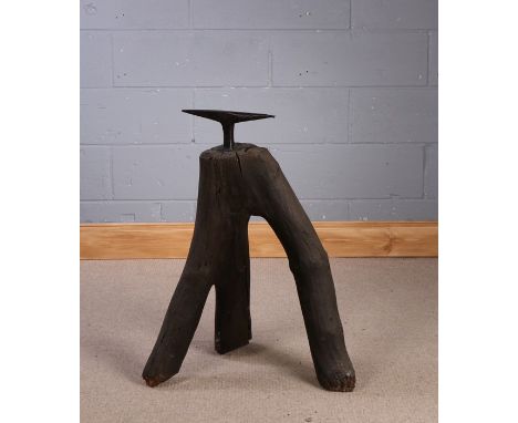 19th Century anvil, the iron anvil above the tripod trunk base, 80cm high