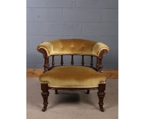 Victorian walnut tub chair, having button down upholstery and spindle back rest, with deep seat and raised on fluted legs and