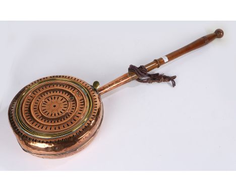 19th Century copper and brass warming pan, of pierced form, with brass press opening button and lever, with turned mahogany h