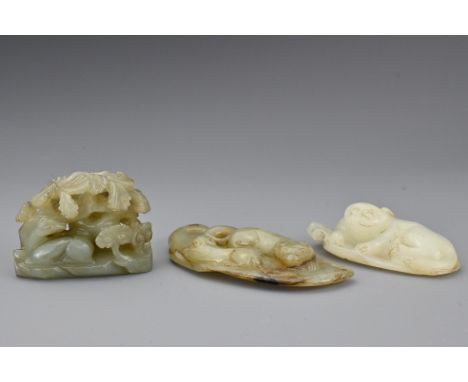 A Chinese celadon jade carving of two deer beside lingzhi fungus under a tree. Together with a white jade pendant in the form