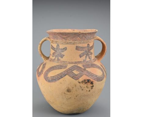 A Chinese Neolithic painted pottery jar. The vessel decorated with geometric patterns to the upper half with two looped handl