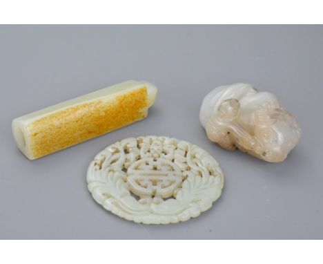 A Chinese jade carving of man with water buffalo together with a pierced circular jade pendant with 'Shou' character design a
