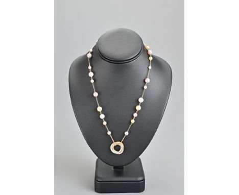 CARTIER Trinity pearl necklace. Rose gold chain sectioned by graduated pearl beads with three interlocked yellow, rose and wh