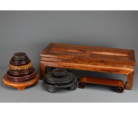 A Chinese footrest / footstool 'gundeng' of rectangular form with two cylindrical rollers. Together with ten various display 
