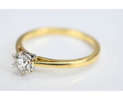 An 18ct diamond solitaire ring. Ring stamped 750. Ring size O/P. Diamond approx. 0.4ct. Weight 2.6 grams. With box.Overall go
