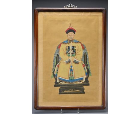 A Chinese ancestral portrait on silk of man dressed in Mandarin robe with phoenix military rank badge. In hardwood frame and 