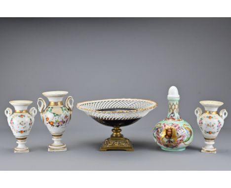 A Continental gilt pedestal dish together with three enamel gilt mantel urns / spill vases and painted bottle with stopper. D