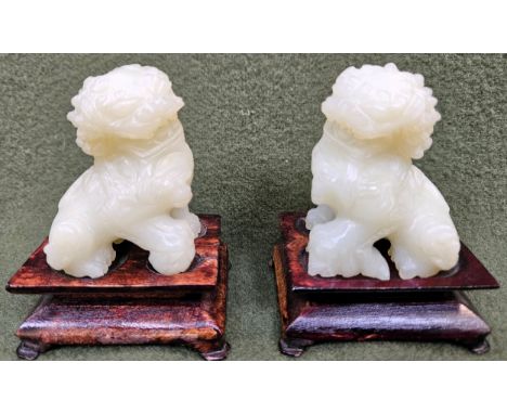 Pair of pretty carved 20th century jade coloured foe dogs, on treen stands. Approx. 9cms H
reasonable used condition