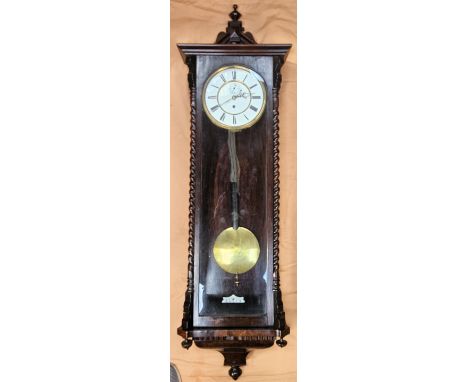 19th century mahogany glazed Vinenna style wall clock with enamelled circular dial. Approx. 120cms H
reasonable used with min