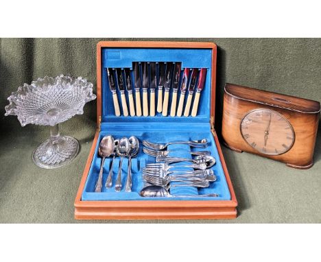 Mixed lot Inc. canteen of cutlery, Art Deco style walnut veneered Two Florin mantle clock, plus glass cakestand
all used unch