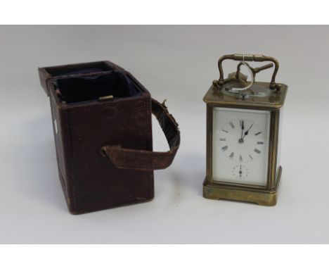 Victorian brass skeleton movement carriage clock with key and fitted Ox blood leather case (with subsidiary dial for alarm) 1