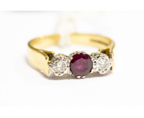 A ruby and diamond ring, claw set with a central round ruby approx 0.45 carat, with diamonds set either side with a total dia