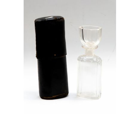 A 19th Century clear cut glass portable spirit flask, circa 1860, broad fluted, the cover incorporating a drinking vessel, in