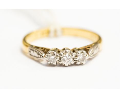 A diamond three stone ring, 18ct gold, size K½, total gross weight approx 3.2 grams 