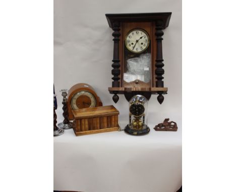 A mahogany Vienna wall clock, circular silvered brass dial with Arabic numerals, turned finial's and supports, later horse su