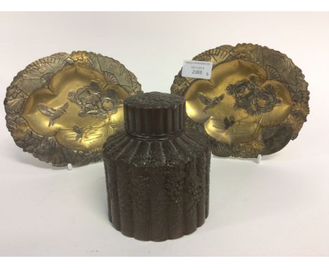 A Japanese bronzed antimony tea caddy - wisteria decorations, 19th Century; together with two 1920s Japanese antimony plaques