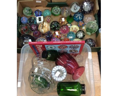 A large collection of colourful paperweights to include some Caithness paperweights, and a paperweight book, one box of glass