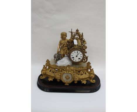 A 19th Century French gilt metal mantle clock with Oriental dial (no key present) Female standing with a sheep and plinth, pe